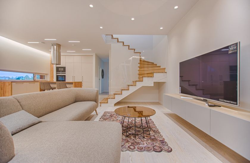 Wall-mounted flat screen TV working in a modern South African living room